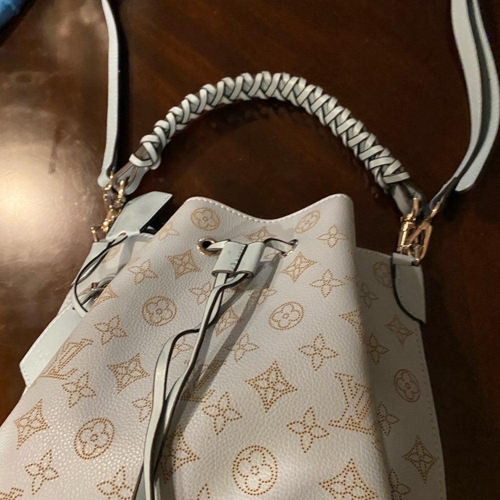 Elegant Designer of Muria Louis Vuitton purse.